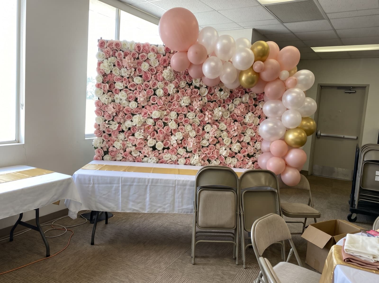 Blush rose flower wall with a corner balloon garland