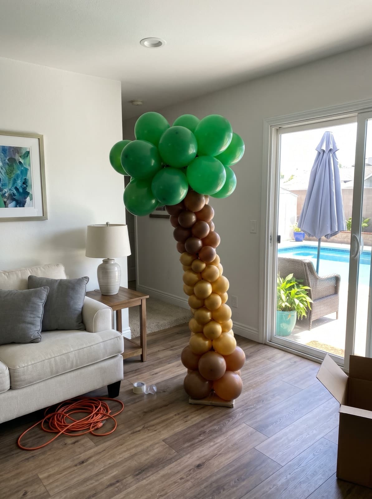 Balloon palm tree column by the sliding door out to the pool