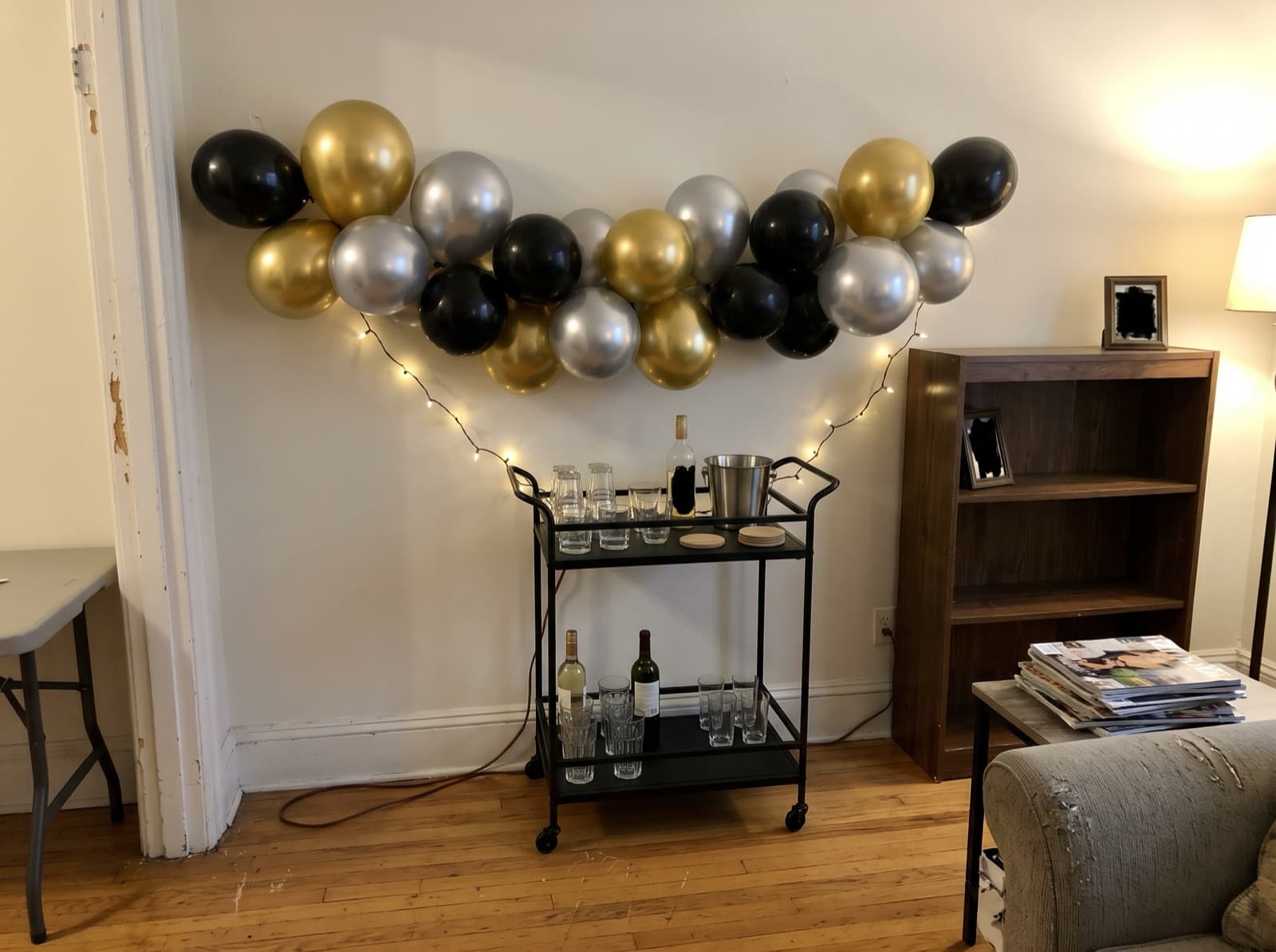 Gold, silver and black chrome garland over a bar cart