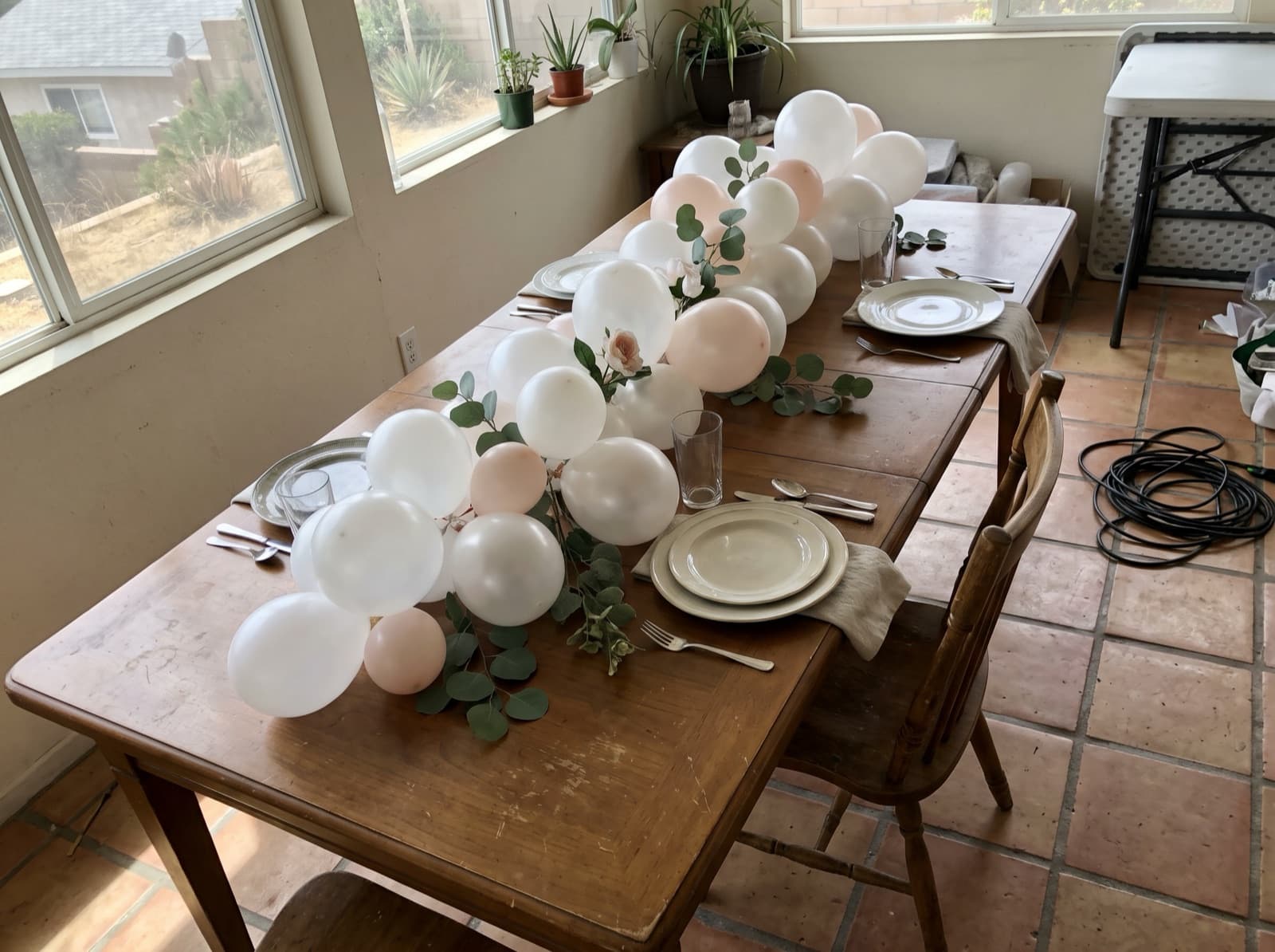 Pearl and white garland with eucalyptus along a brunch table