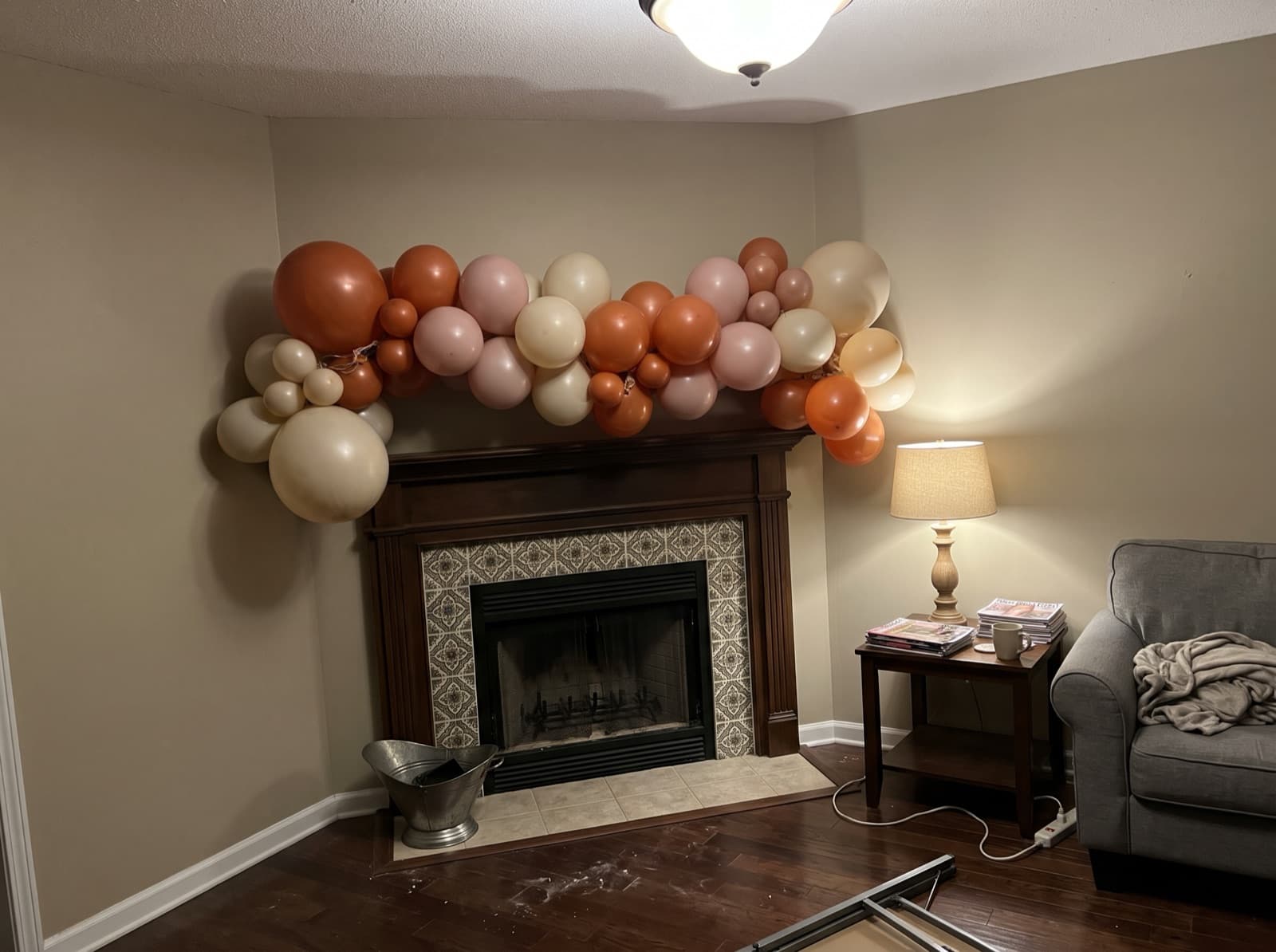 Rust, blush and cream garland draped on a wood mantel