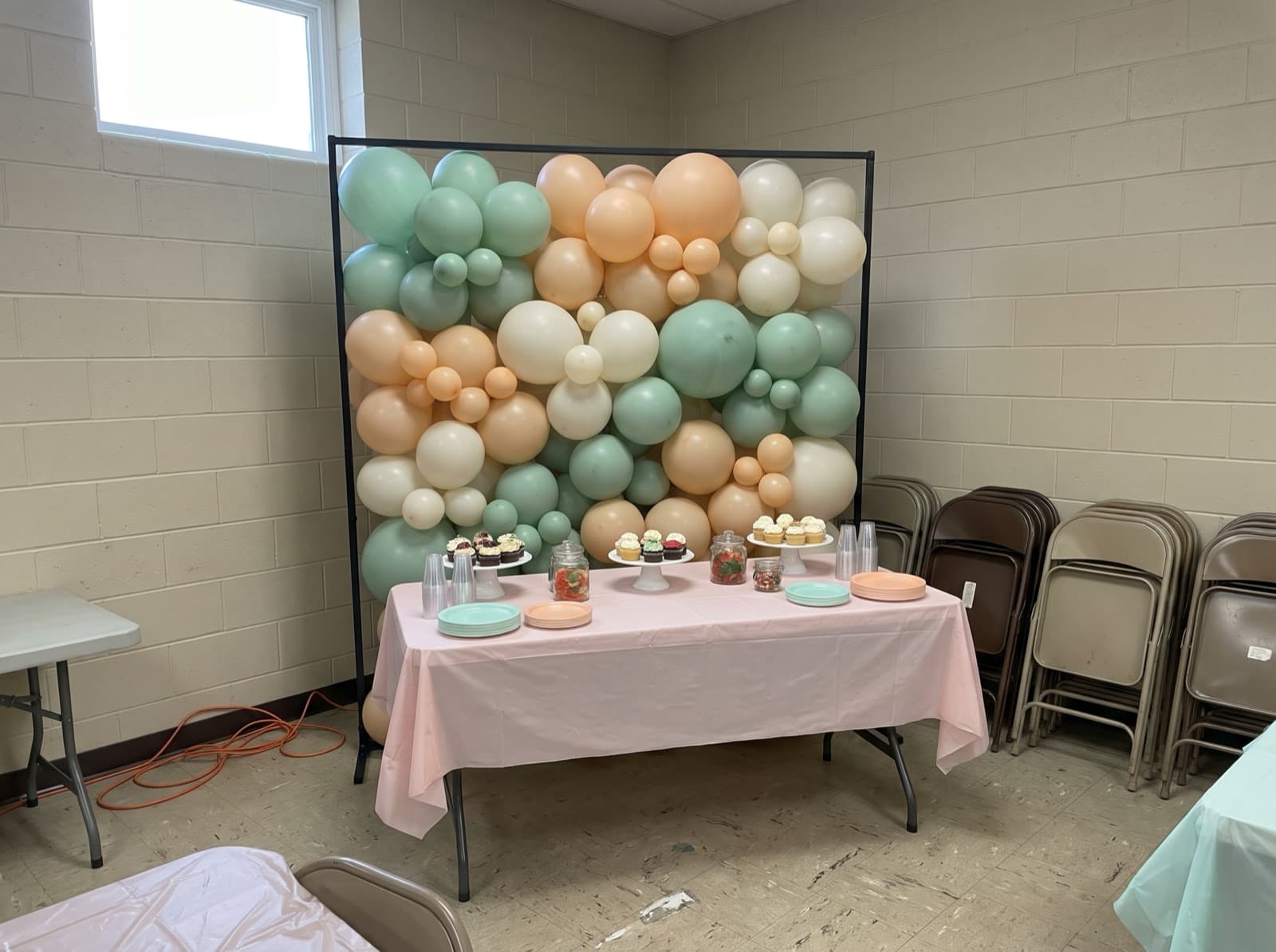 Mint, peach and white balloons filling a square frame